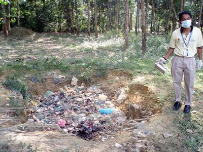 dug-up place where the villagers throw their rubbish